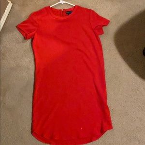 Red dress with gold zipper on the back.